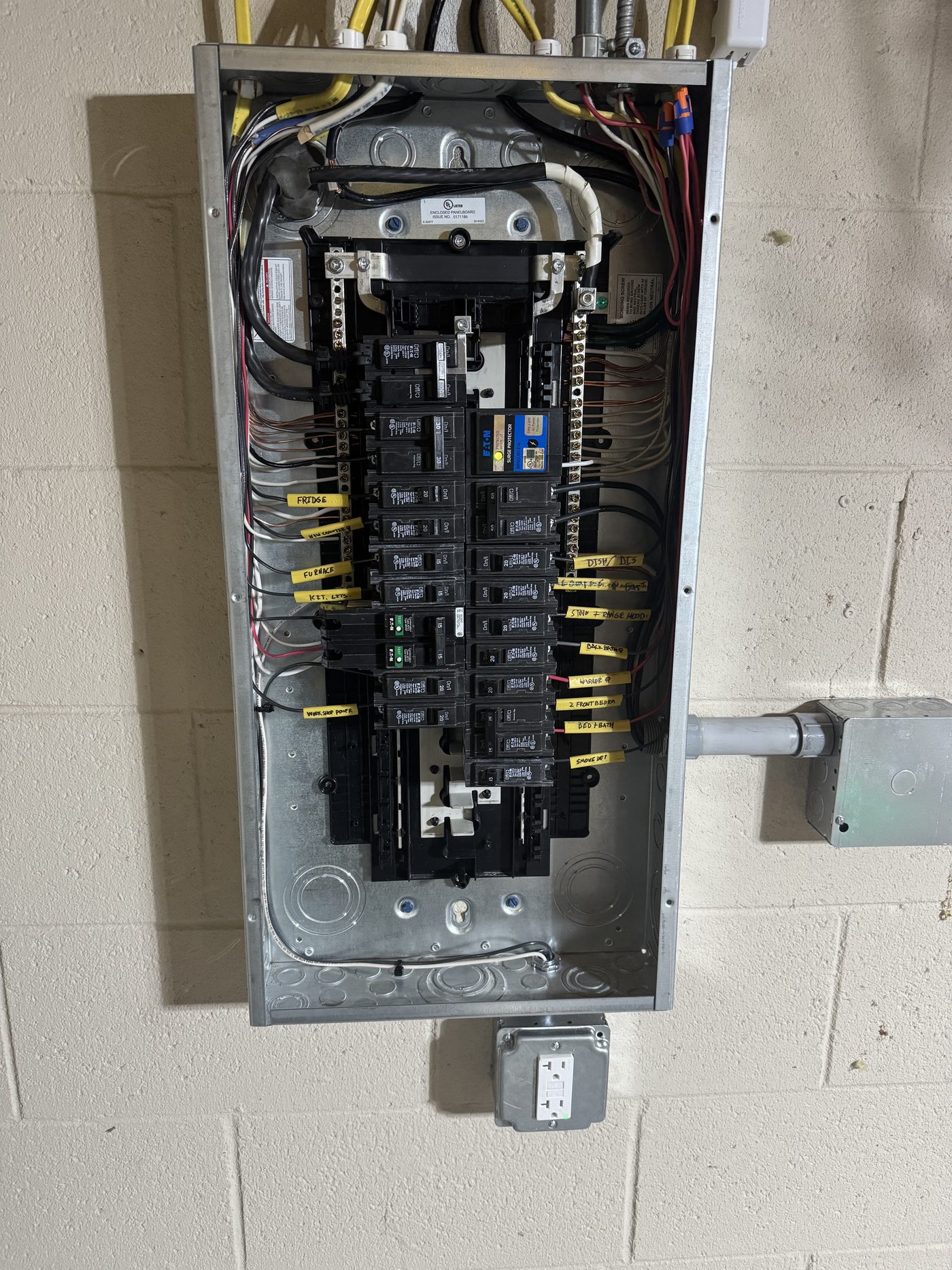 Open electrical panel with neatly wired breakers
